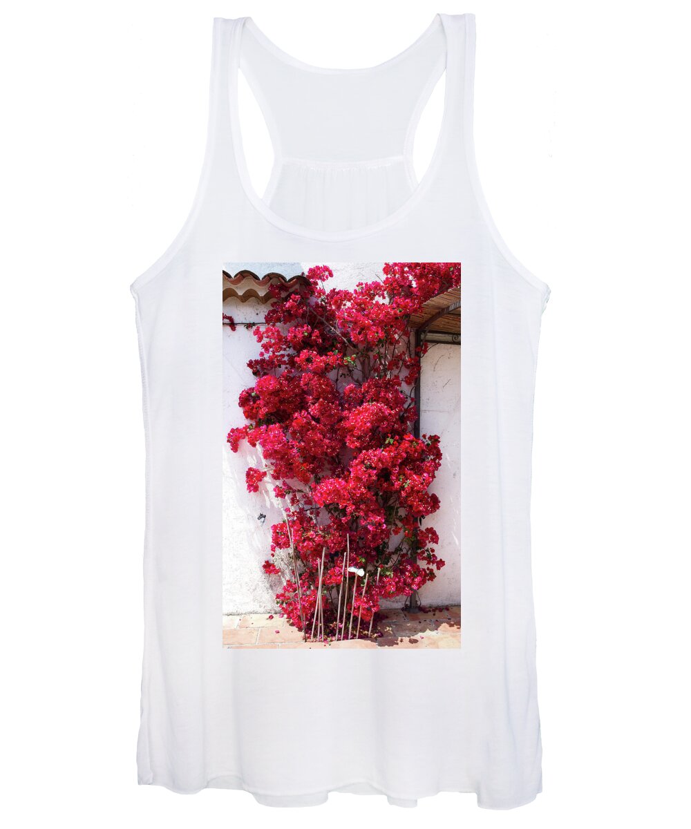 Background Women's Tank Top featuring the photograph Glowing red bougainvillea in front of a white wall by Jean-Luc Farges