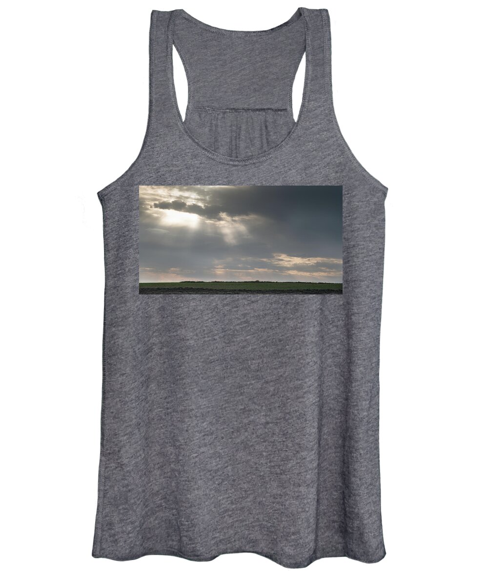Sunlight Women's Tank Top featuring the photograph Sun rays between dramatic stormy clouds. by Michalakis Ppalis