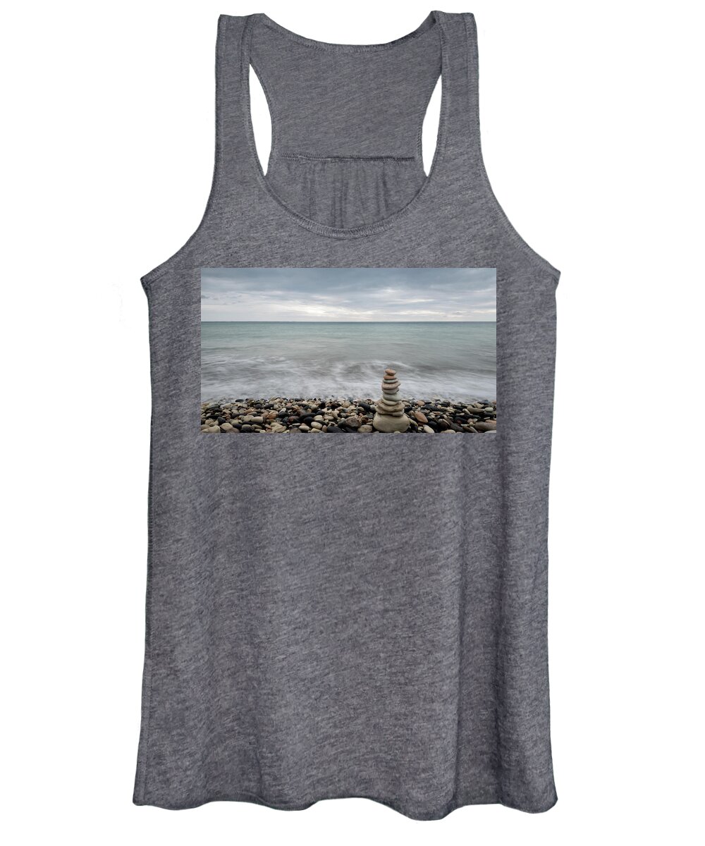 Sea And Ocean Women's Tank Top featuring the photograph Pyramid of balancing stones , in the wavy ocean by Michalakis Ppalis
