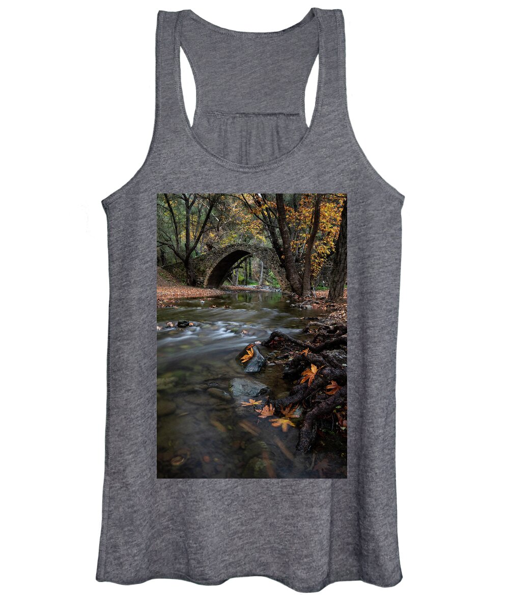 Autumn Women's Tank Top featuring the photograph Autumn landscape with river flowing under a stoned bridge by Michalakis Ppalis
