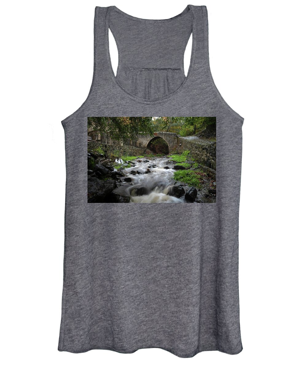 River Women's Tank Top featuring the photograph Medieval stoned bridge water flowing in the river. by Michalakis Ppalis