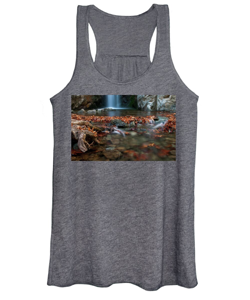 Troodos Women's Tank Top featuring the photograph Waterfall and river flowing with maple leaves on the rocks on the river in Autumn by Michalakis Ppalis
