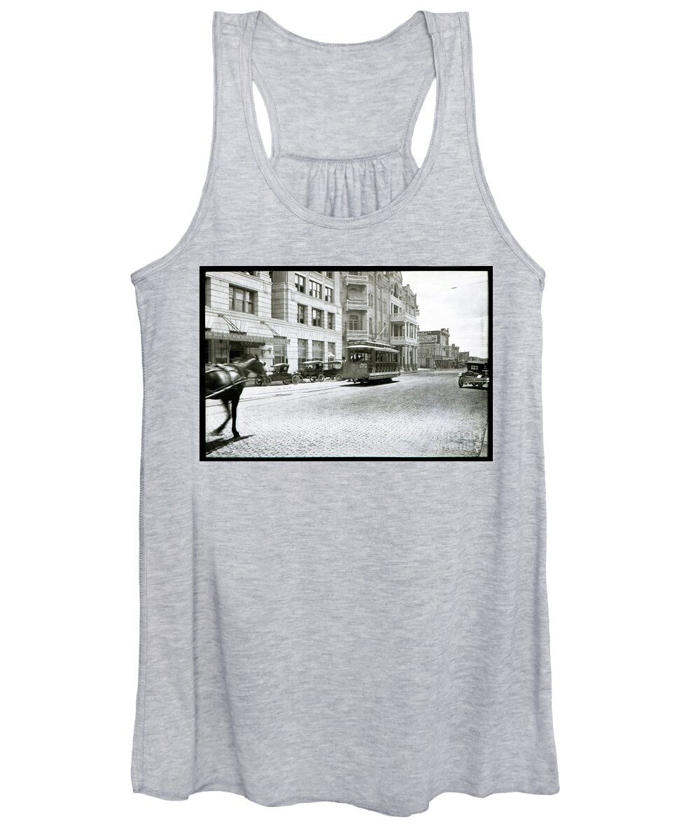 Cable Car Women's Tank Top featuring the photograph A cable car drives past the Littlefield Building and Driskill Hotel on 6th in downtown Austin, Texas by Dan Herron