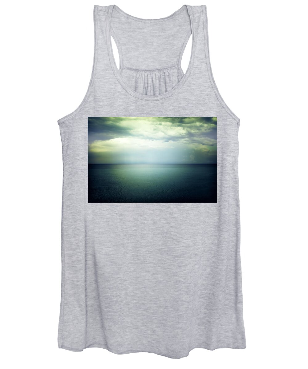 Sea Women's Tank Top featuring the photograph Light in the sky above the dark gloomy sea by GoodMood Art