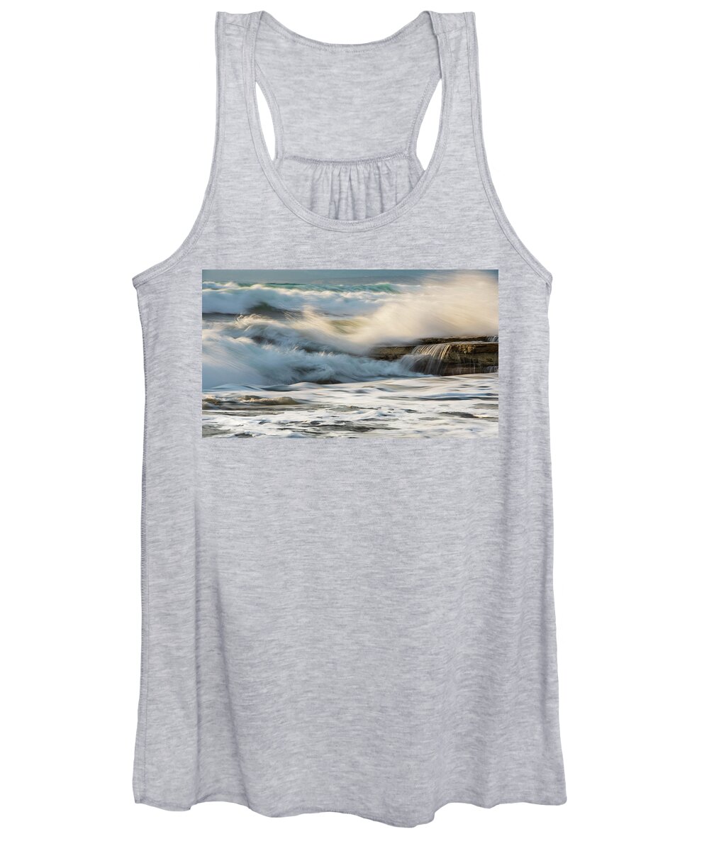 Sea Waves Women's Tank Top featuring the photograph Rocky seashore, wavy ocean and wind waves crashing on the rocks by Michalakis Ppalis