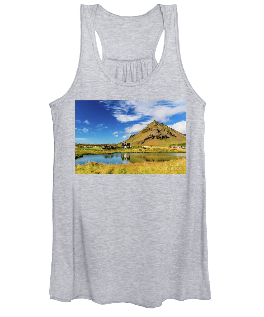 Arnarstapi Women's Tank Top featuring the photograph Arnarstapi Amtmansshus and Mount Stapafell, Iceland by Lyl Dil Creations