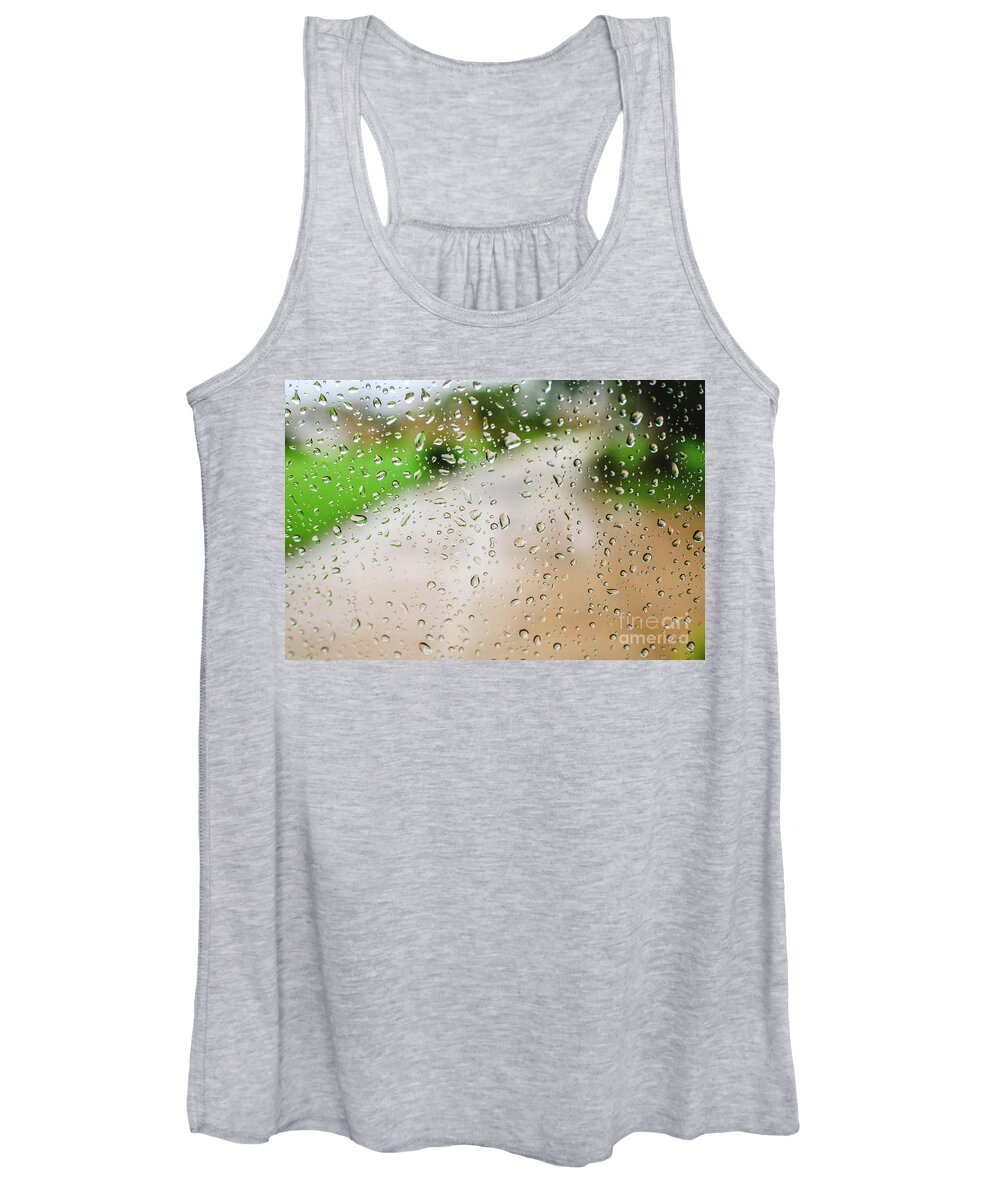 Alone Women's Tank Top featuring the photograph Drops of rain on an autumn day on a glass. by Joaquin Corbalan