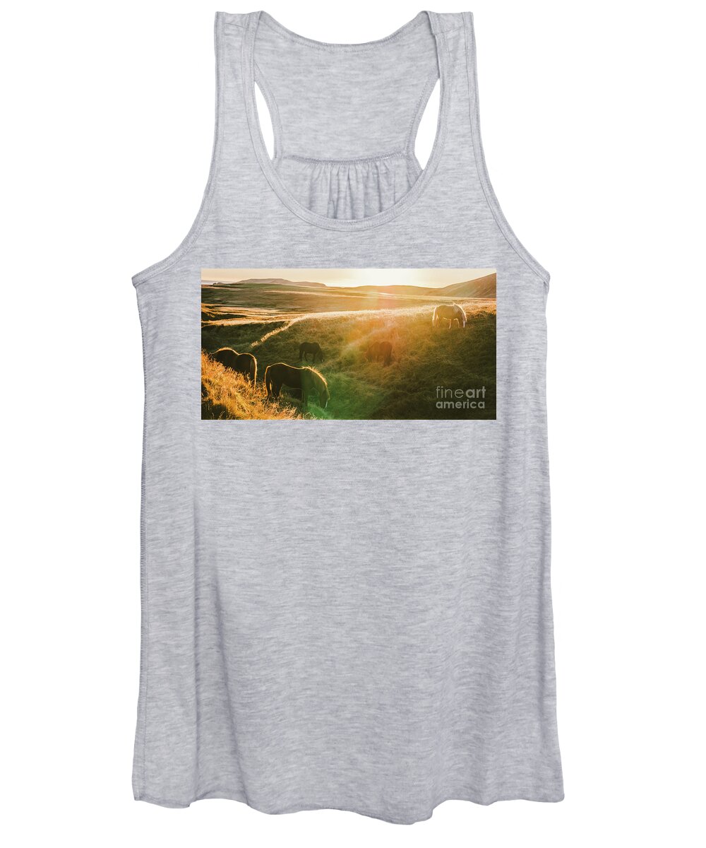 Animal Women's Tank Top featuring the photograph Icelandic landscapes, sunset in a meadow with horses grazing ba by Joaquin Corbalan