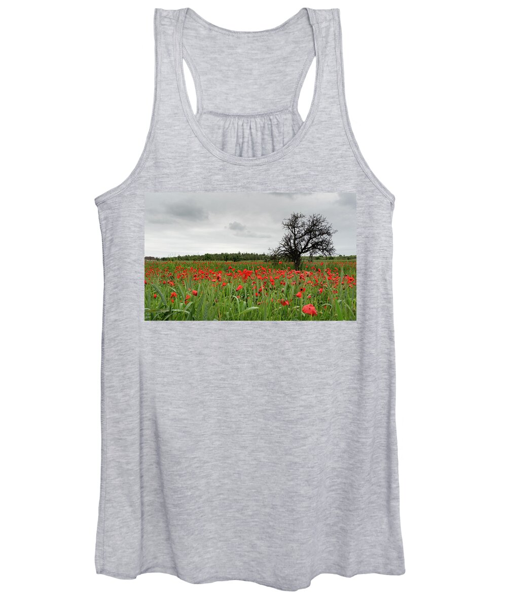 Poppy Anemone Women's Tank Top featuring the photograph Field full of red beautiful poppy anemone flowers and a lonely dry tree. Spring time, spring landscape Cyprus. by Michalakis Ppalis