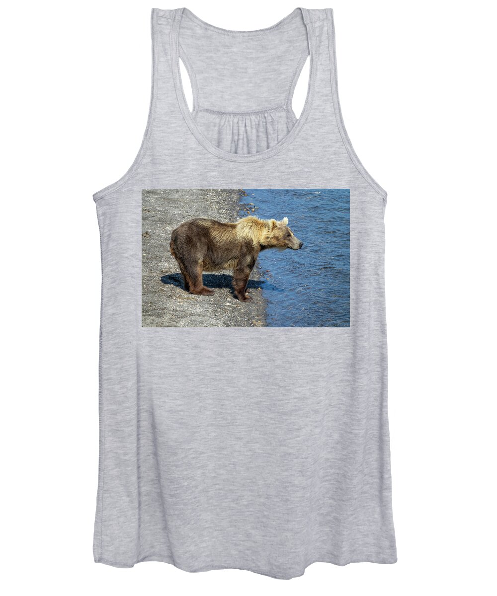 Bear Women's Tank Top featuring the photograph Brown bear looking for fish in river by Mikhail Kokhanchikov