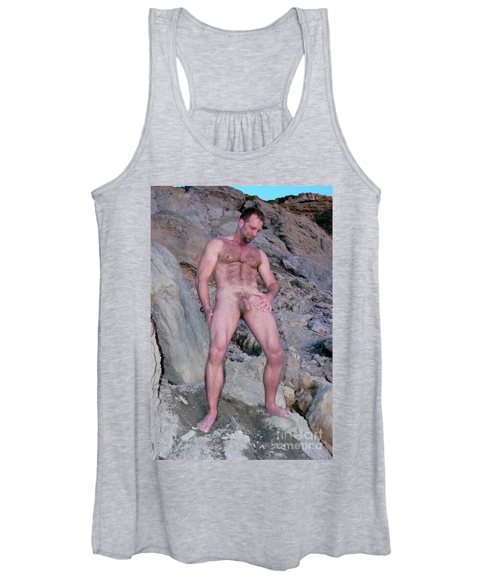 Nude Women's Tank Top featuring the photograph Handsome and sexy hairy man stands in front of a rocky hillside. by Gunther Allen