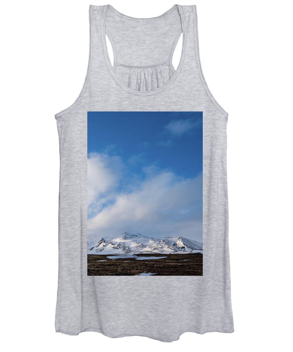 Iceland Women's Tank Top featuring the photograph Icelandic landscape with mountains and meadow land covered in sn by Michalakis Ppalis