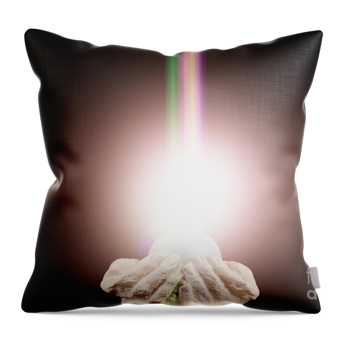  Spiritual Throw Pillow featuring the photograph Spiritual light in cupped hands on a black background by Simon Bratt