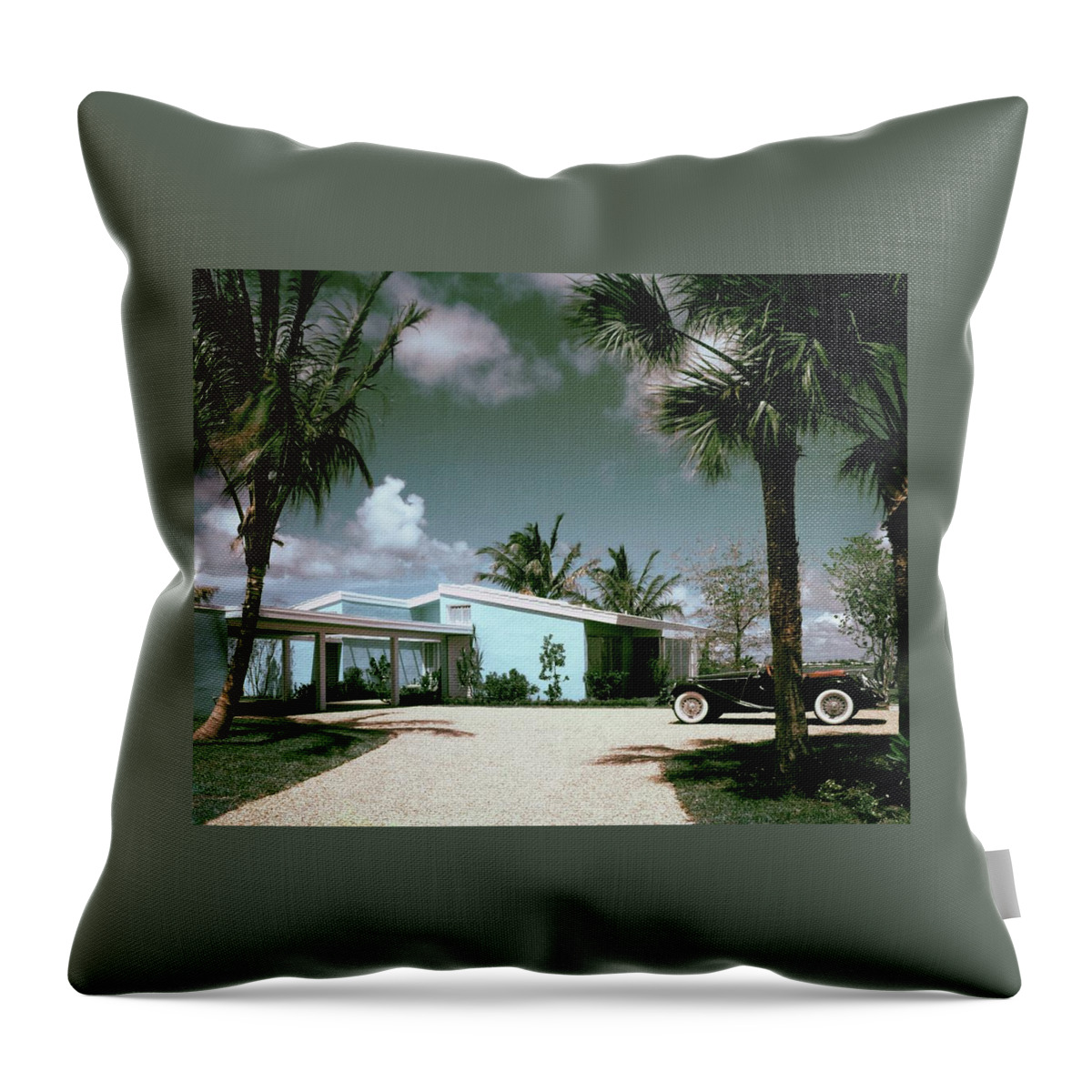 A Vintage Car Parked Outside A Blue House Throw Pillow