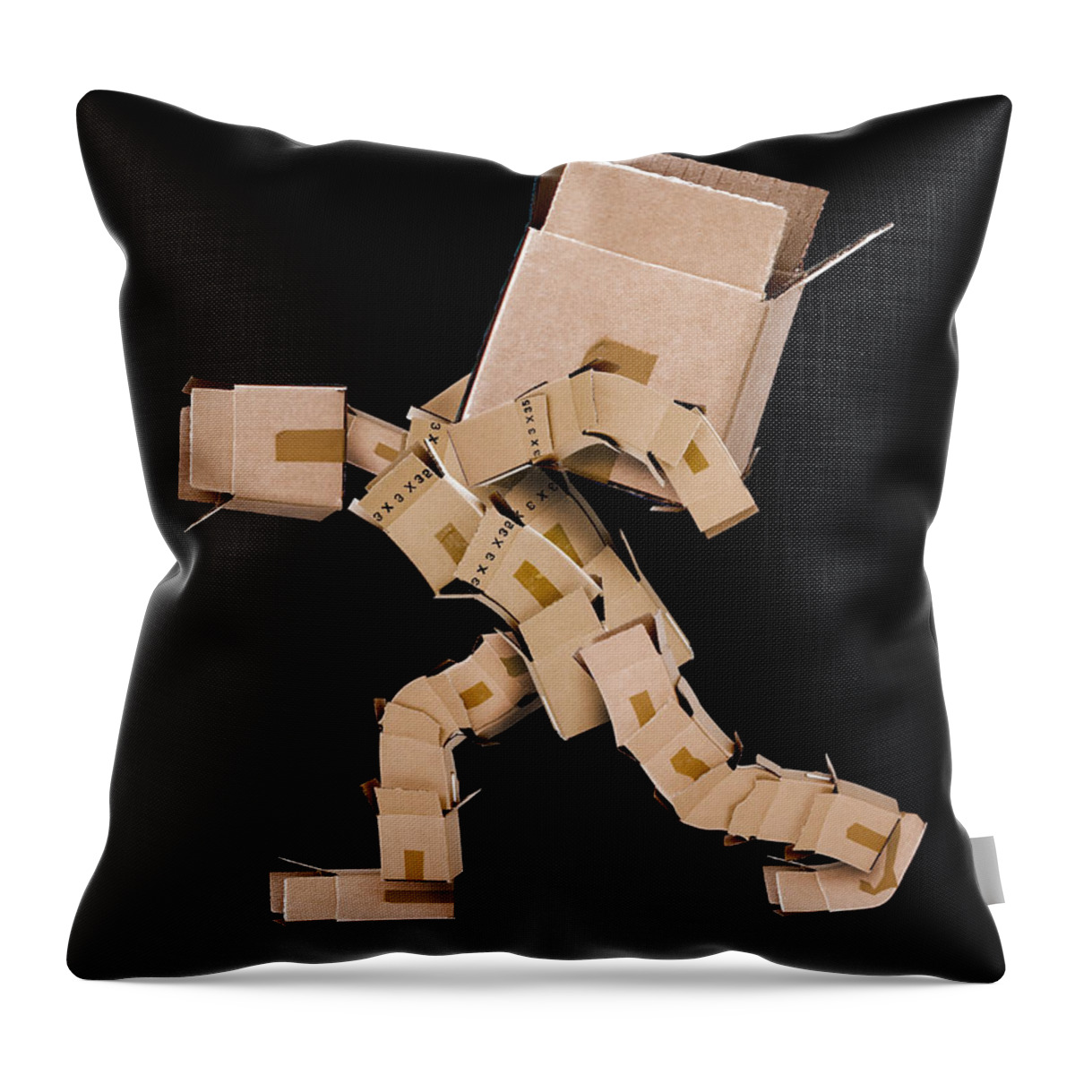 Strength Throw Pillow featuring the photograph Box character carrying large box by Simon Bratt