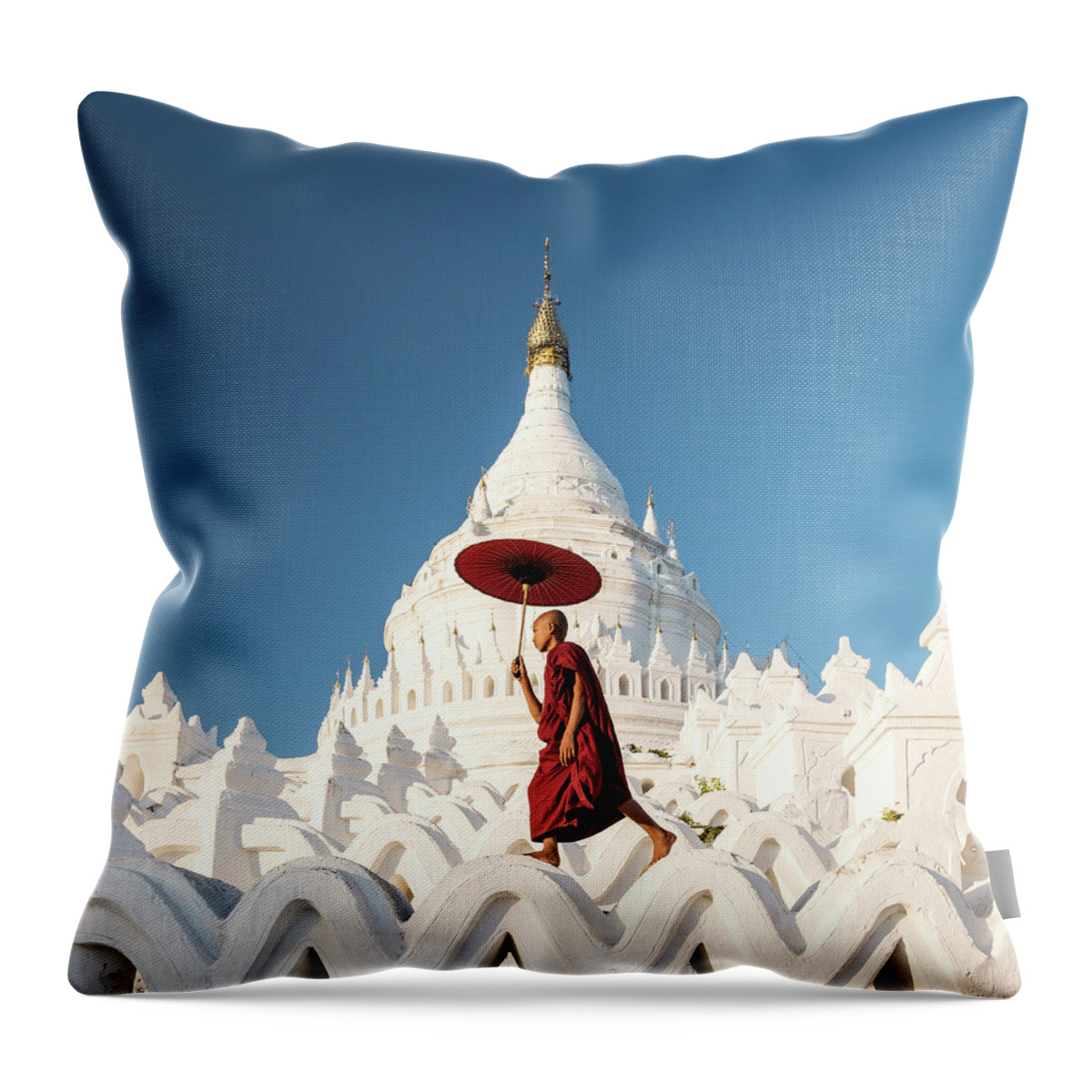 Pagoda Throw Pillow featuring the photograph Buddhist Monk Walking Across Arches Of by Martin Puddy