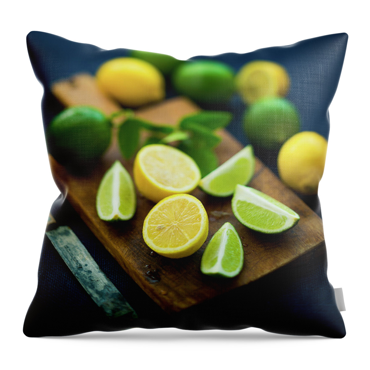 Orange Color Throw Pillow featuring the photograph Lemons And Limes by Thepalmer