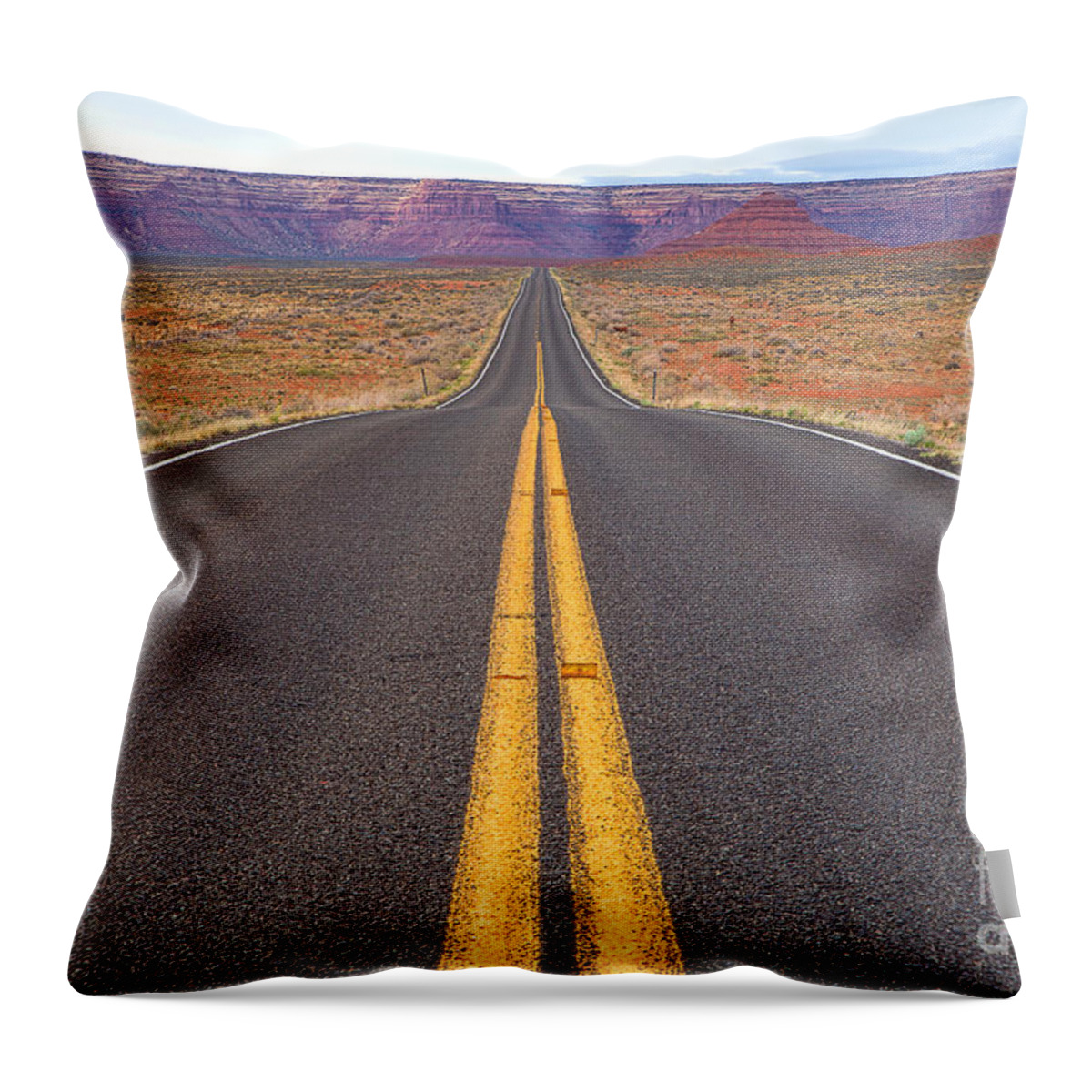 Red Soil Throw Pillow featuring the photograph The Long Road Ahead by Jim Garrison