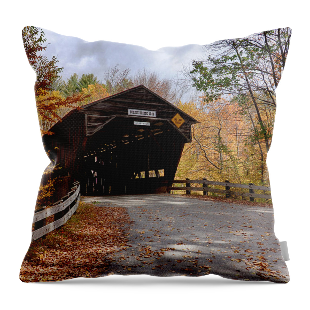#jefffolger Throw Pillow featuring the photograph Fall colors over the Durgin Covered Bridge by Jeff Folger