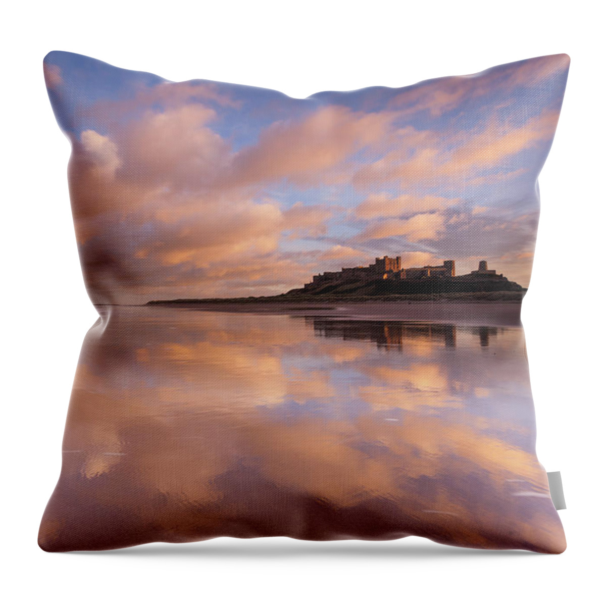 Bamburgh Castle Throw Pillow featuring the photograph Bamburgh Castle sunset reflections on the beach by Anita Nicholson