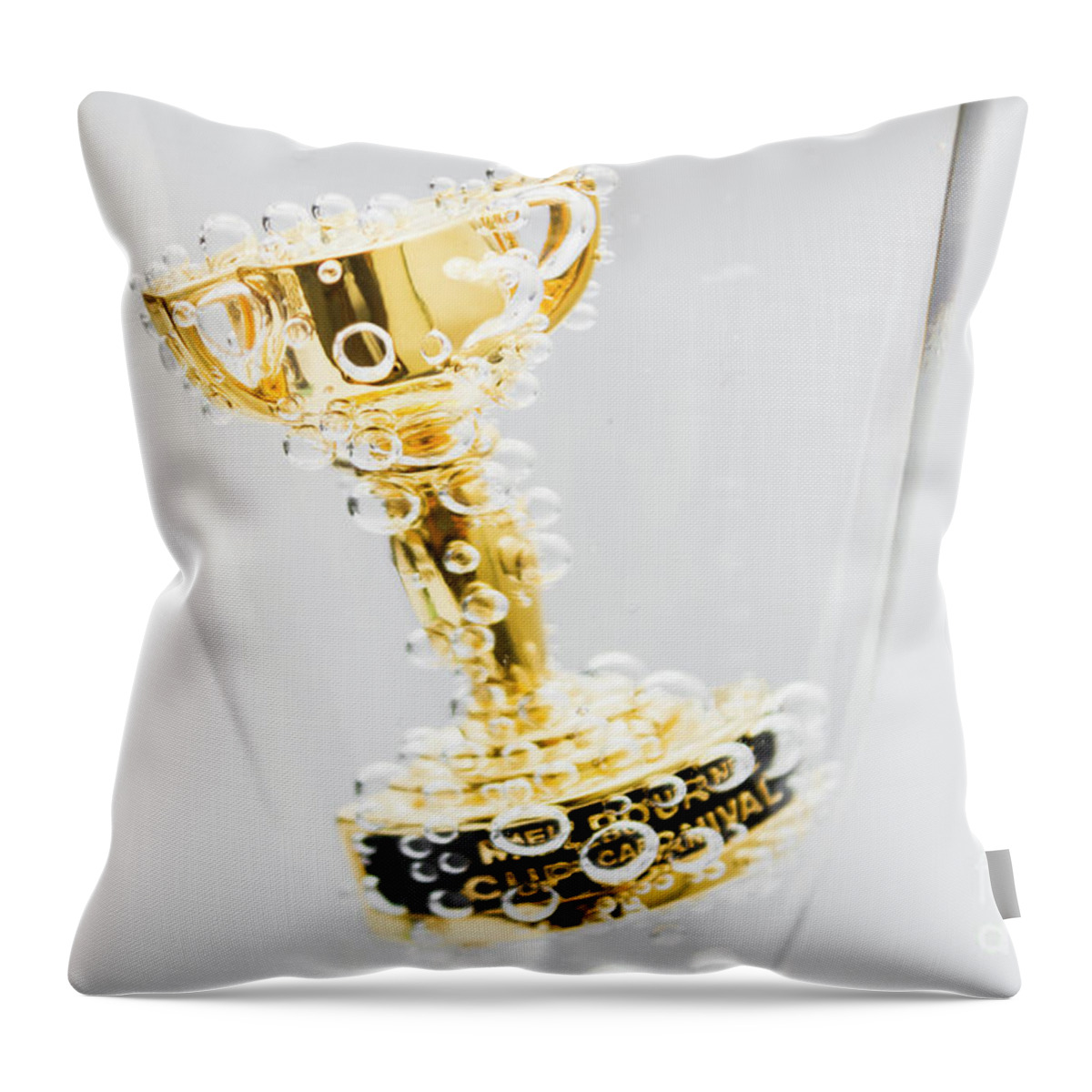 Horse Throw Pillow featuring the photograph Closeup of small trophy in champagne flute. Gold colored award i by Jorgo Photography