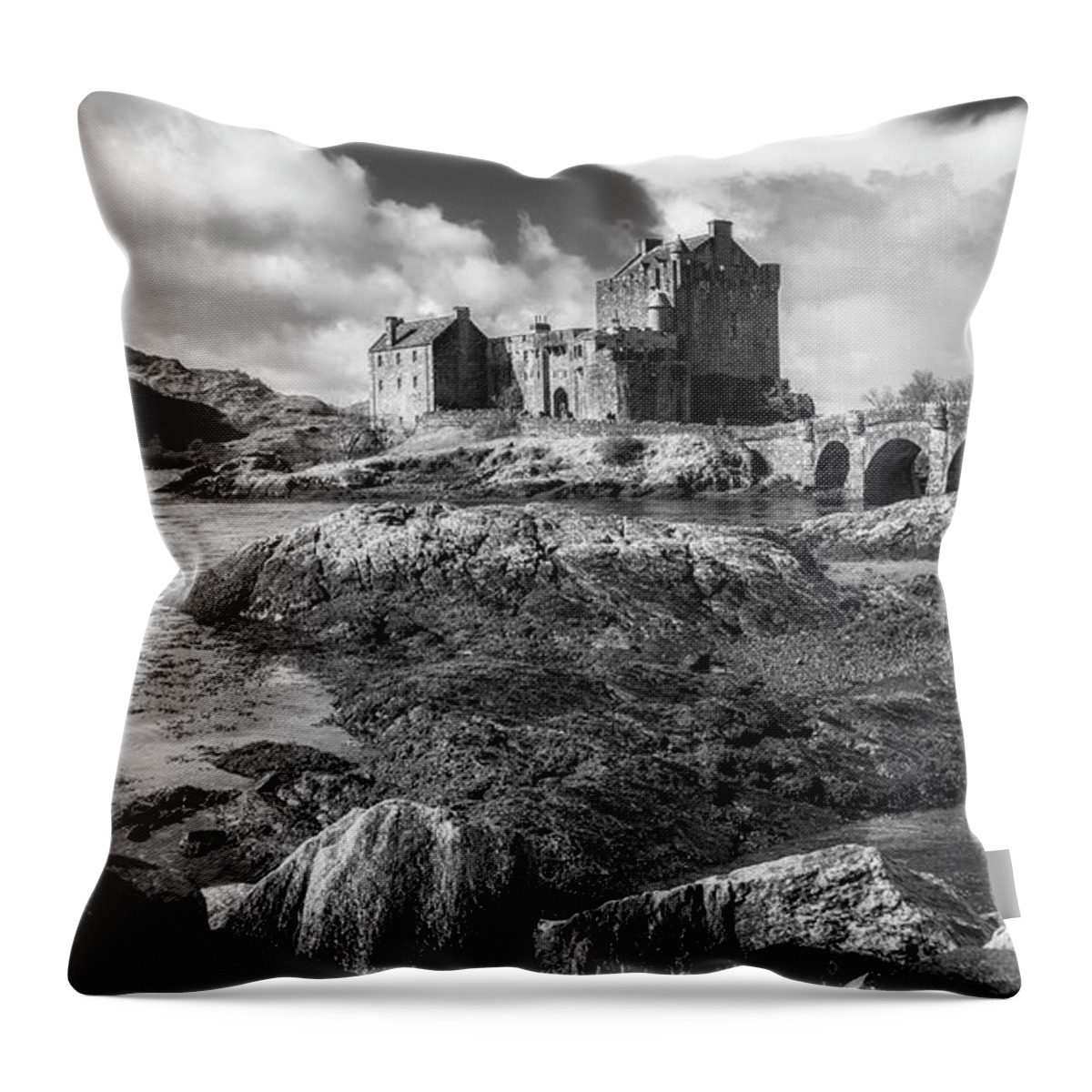 Eilean Donan Throw Pillow featuring the photograph Eilean Donan Castle in black and white by Holly Ross
