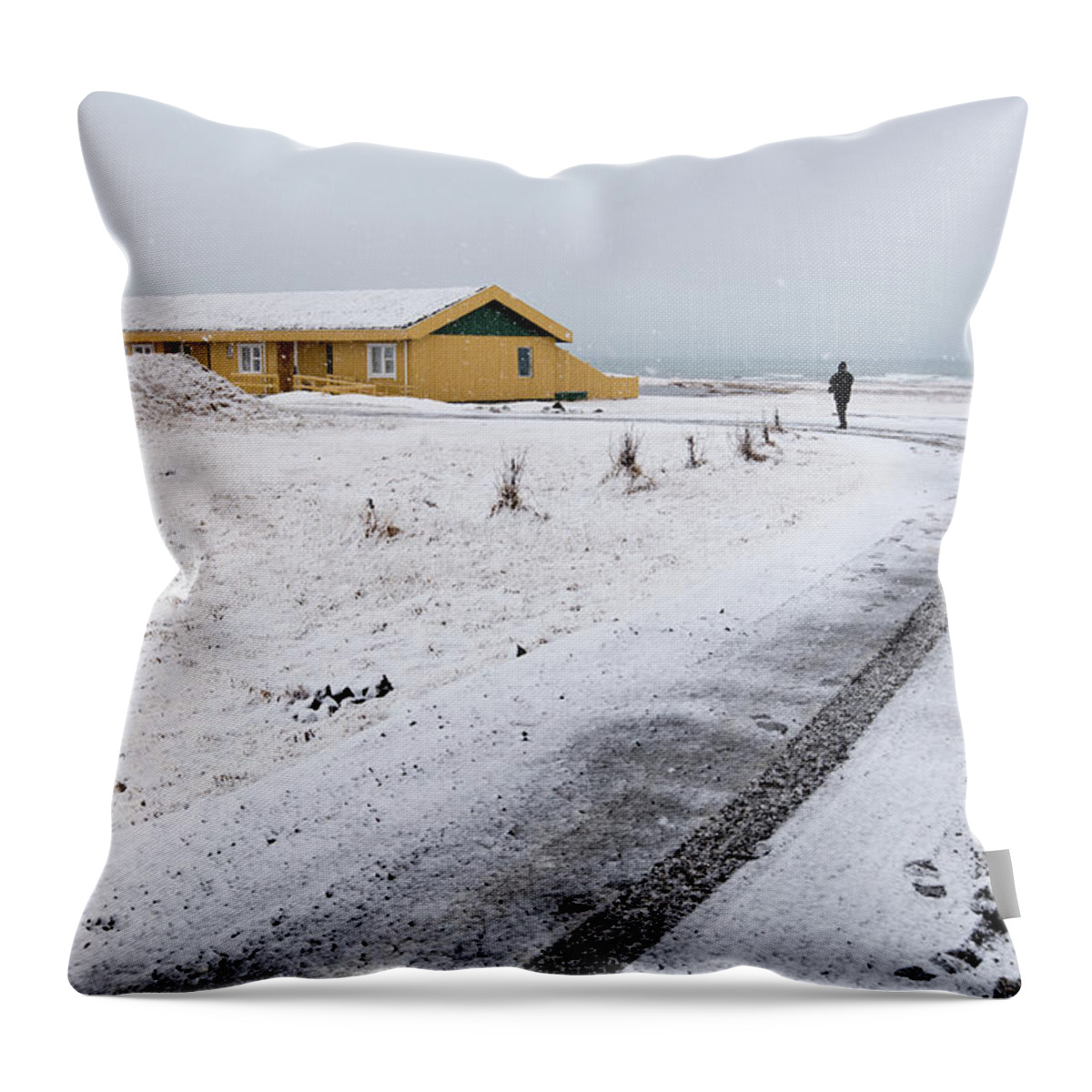 Iceland Throw Pillow featuring the photograph Man walking in snow Iceland by Michalakis Ppalis