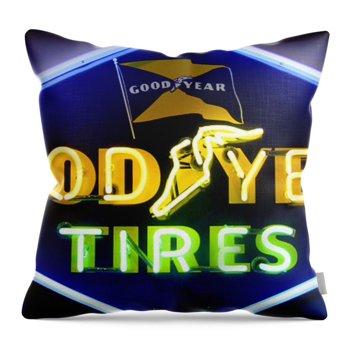 Transportation Throw Pillow featuring the photograph Neon Goodyear Tires Sign by Mike McGlothlen