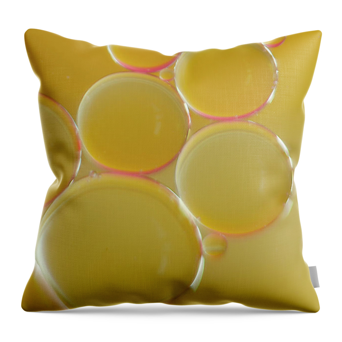 Water Throw Pillow featuring the photograph Oil bubbles on water abstract by Andy Myatt