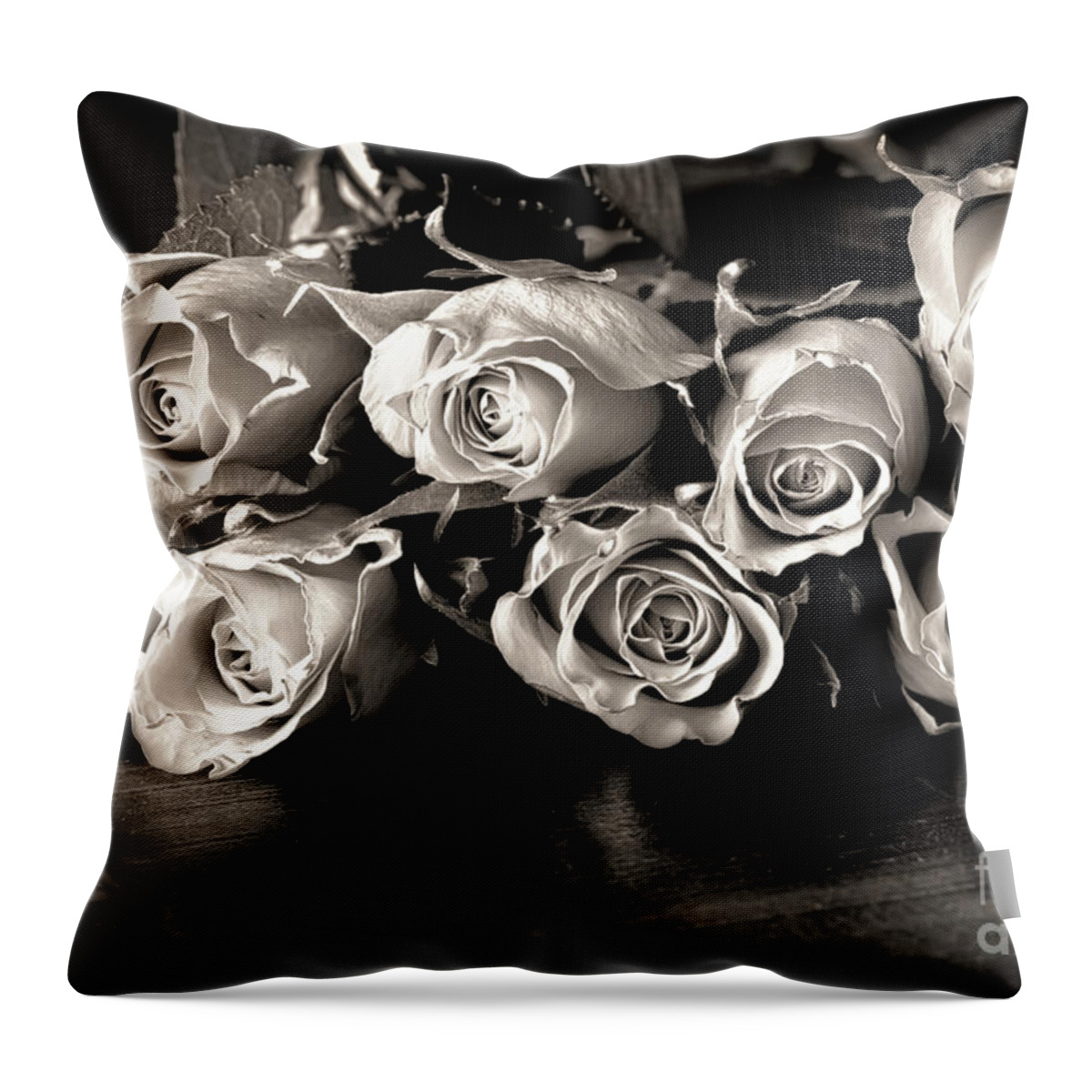 Roses Throw Pillow featuring the photograph Roses on a table in black and white by Simon Bratt