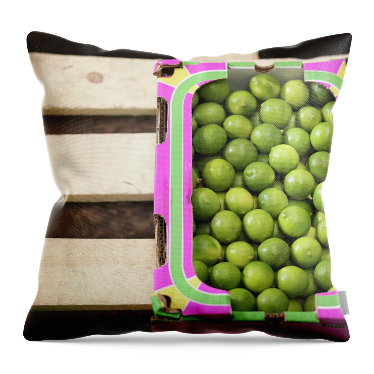 Bradford Throw Pillow featuring the photograph Close Up Of Box Of Limes by Monty Rakusen