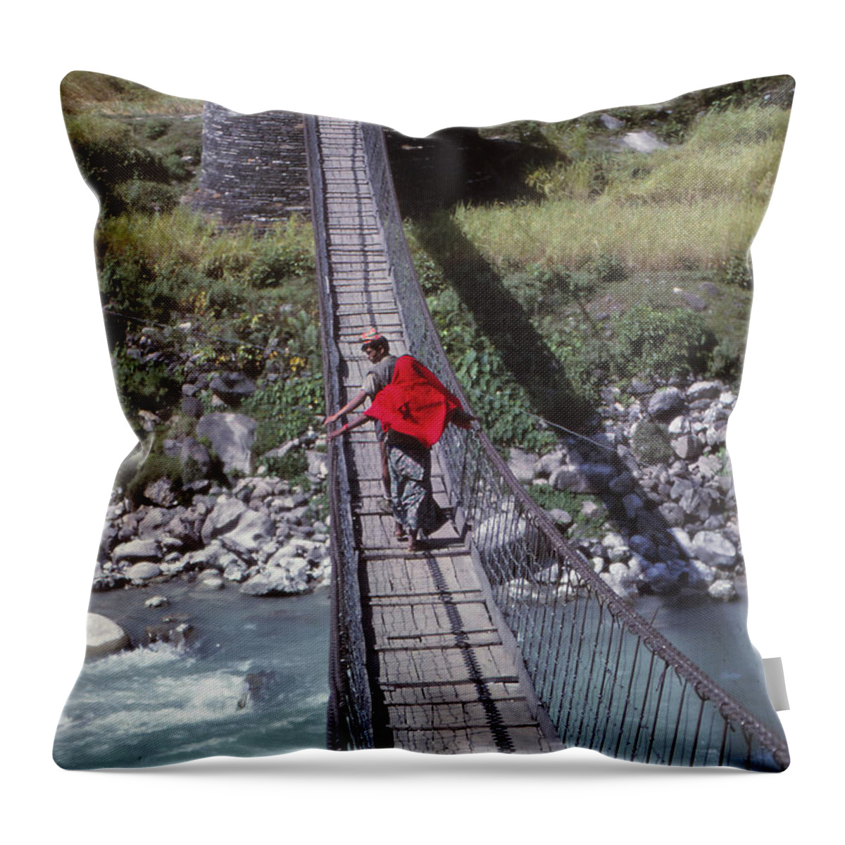 Nepal Throw Pillow featuring the photograph Crossing a suspension bridge by Steve Estvanik