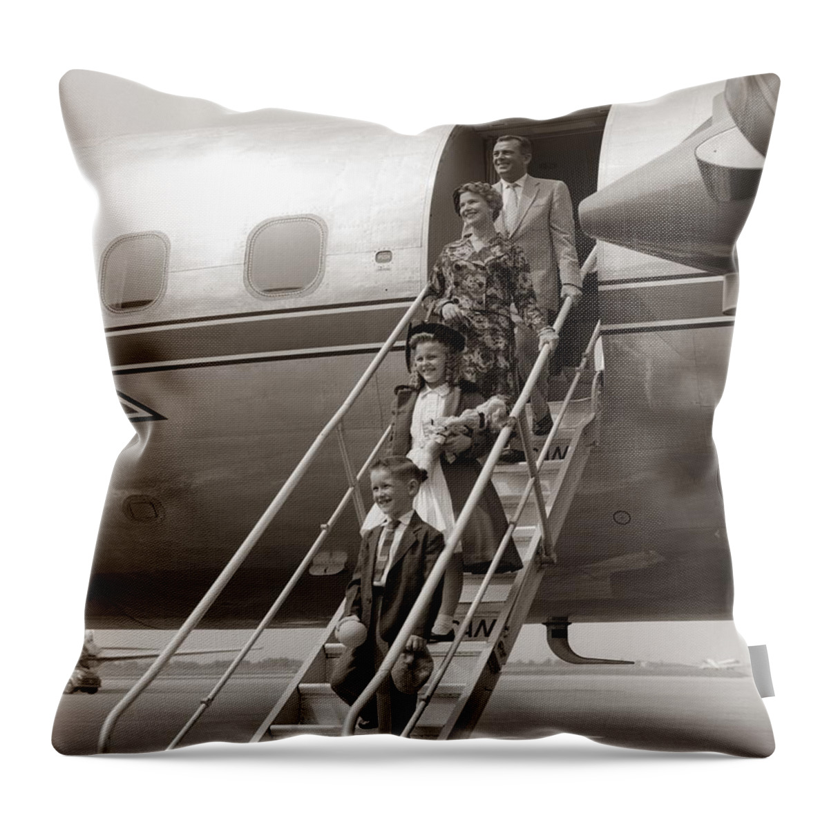 Steps Throw Pillow featuring the photograph Family Walking Down Airplane Stairs by H. Armstrong Roberts