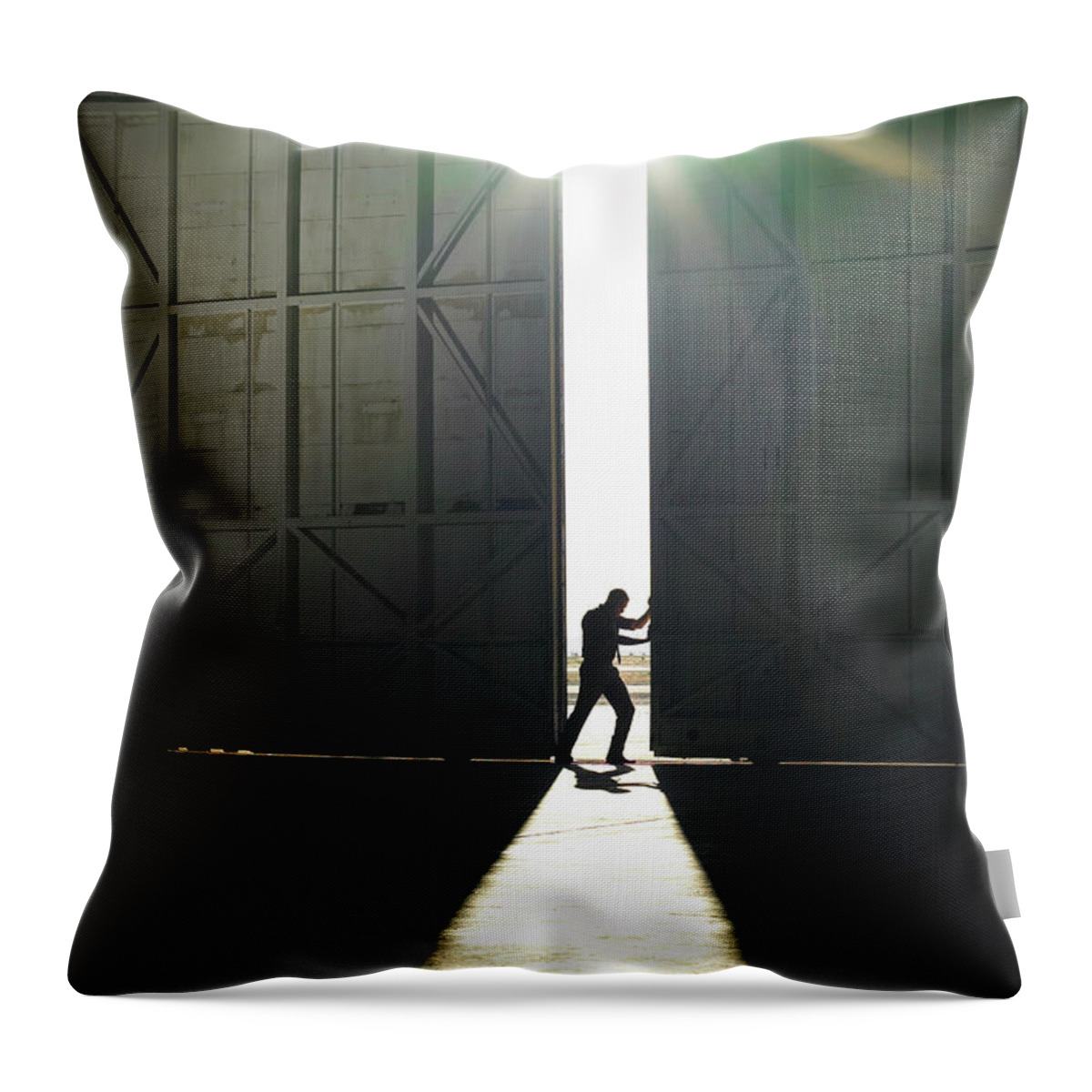 People Throw Pillow featuring the photograph Man Pushing Door Open by Ryan Mcvay
