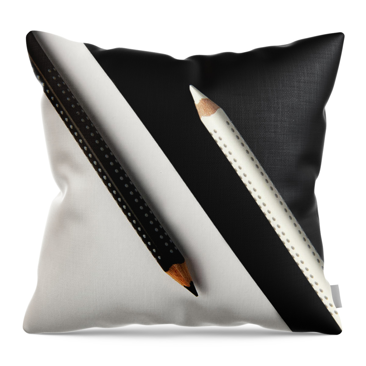 Pencil Throw Pillow featuring the photograph Two drawing pencils on a black and white surface. by Michalakis Ppalis