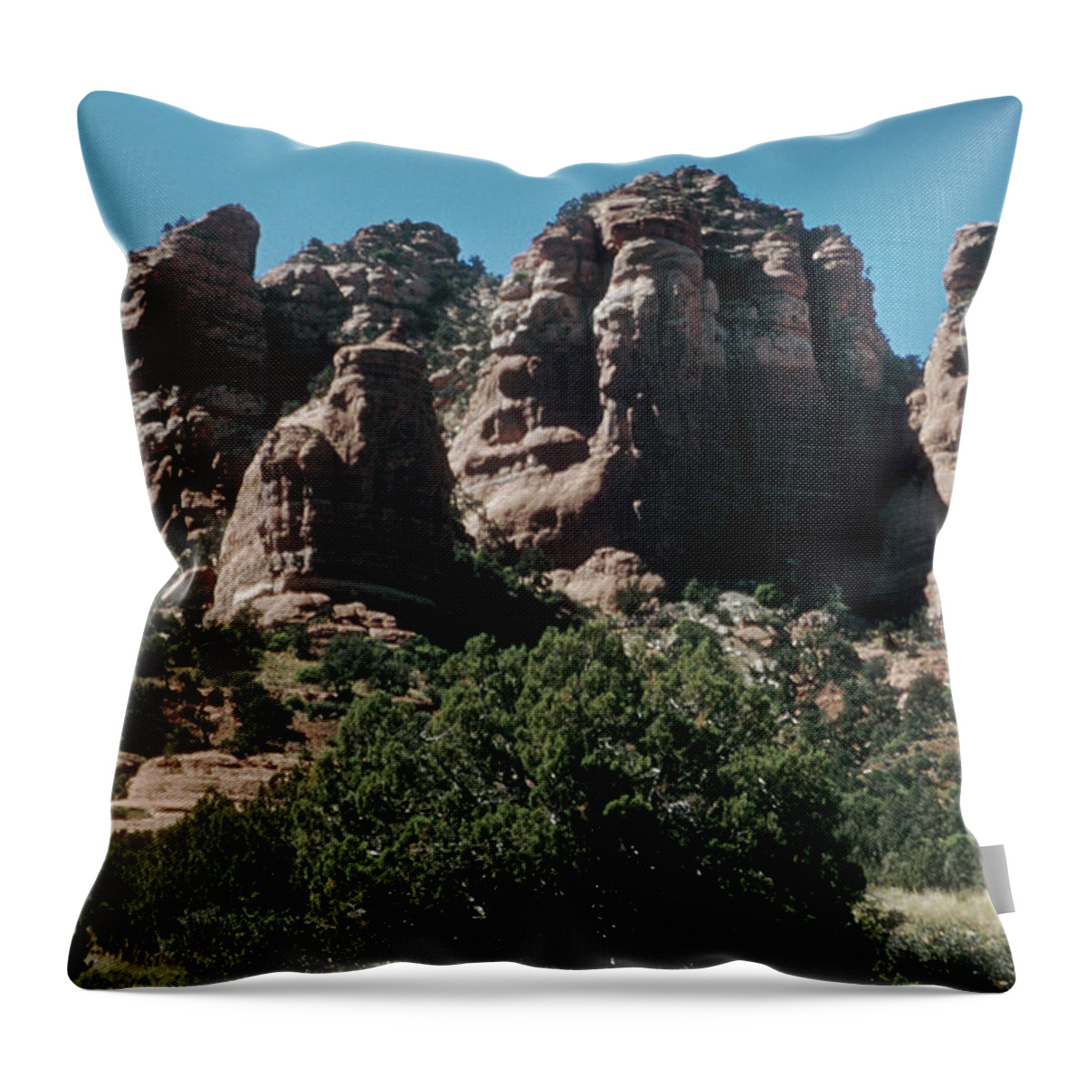 https://render.fineartamerica.com/images/rendered/default/throw-pillow/images/artworkimages/medium/2/weathered-mountain-arizona-oak-creek-canyon-arizona-ariz400-00102-kevin-russell.jpg?&targetx=-124&targety=0&imagewidth=727&imageheight=479&modelwidth=479&modelheight=479&backgroundcolor=635F50&orientation=0&producttype=throwpillow-14-14