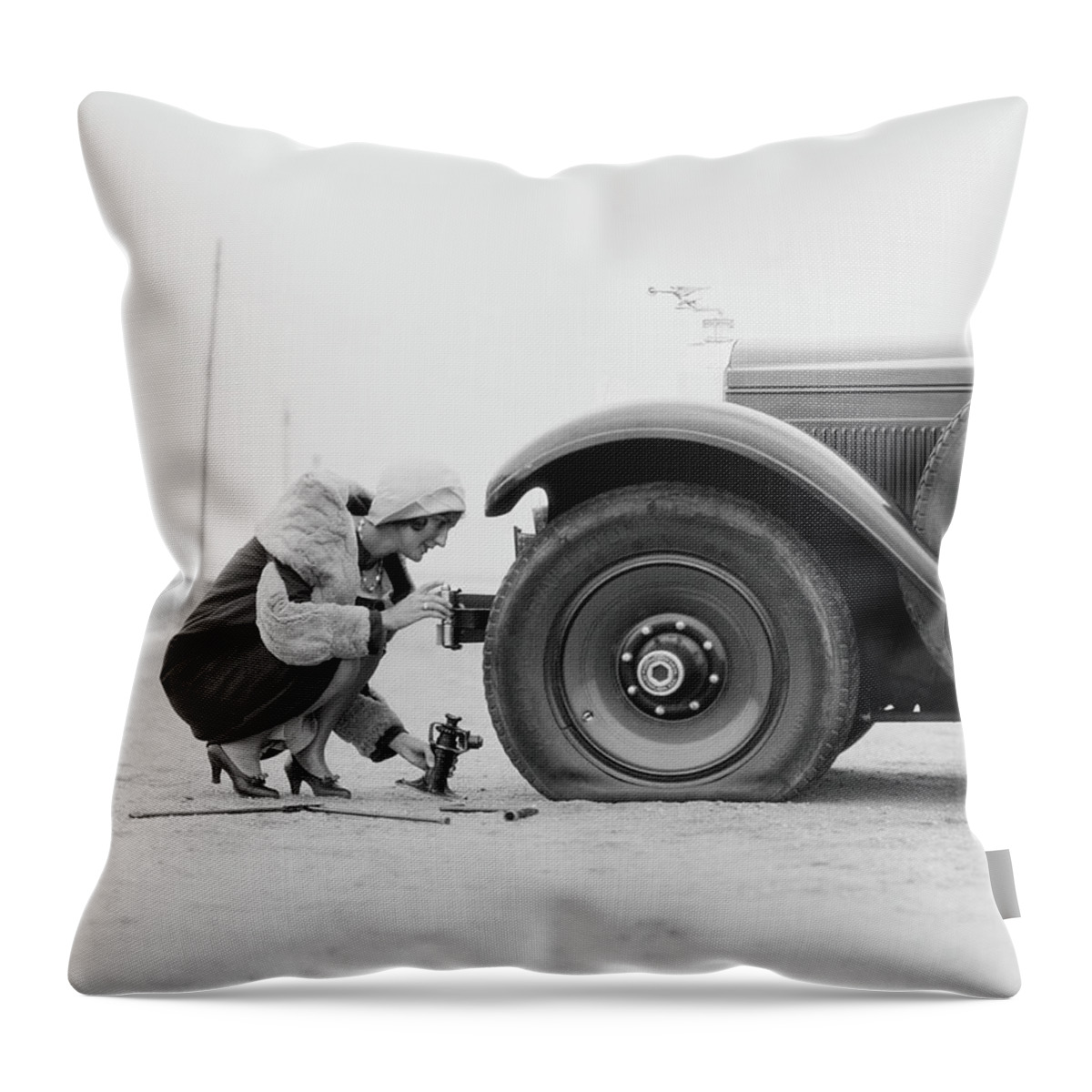 Woman Changing Flat Tire On Car Throw Pillow by H. Armstrong Roberts 