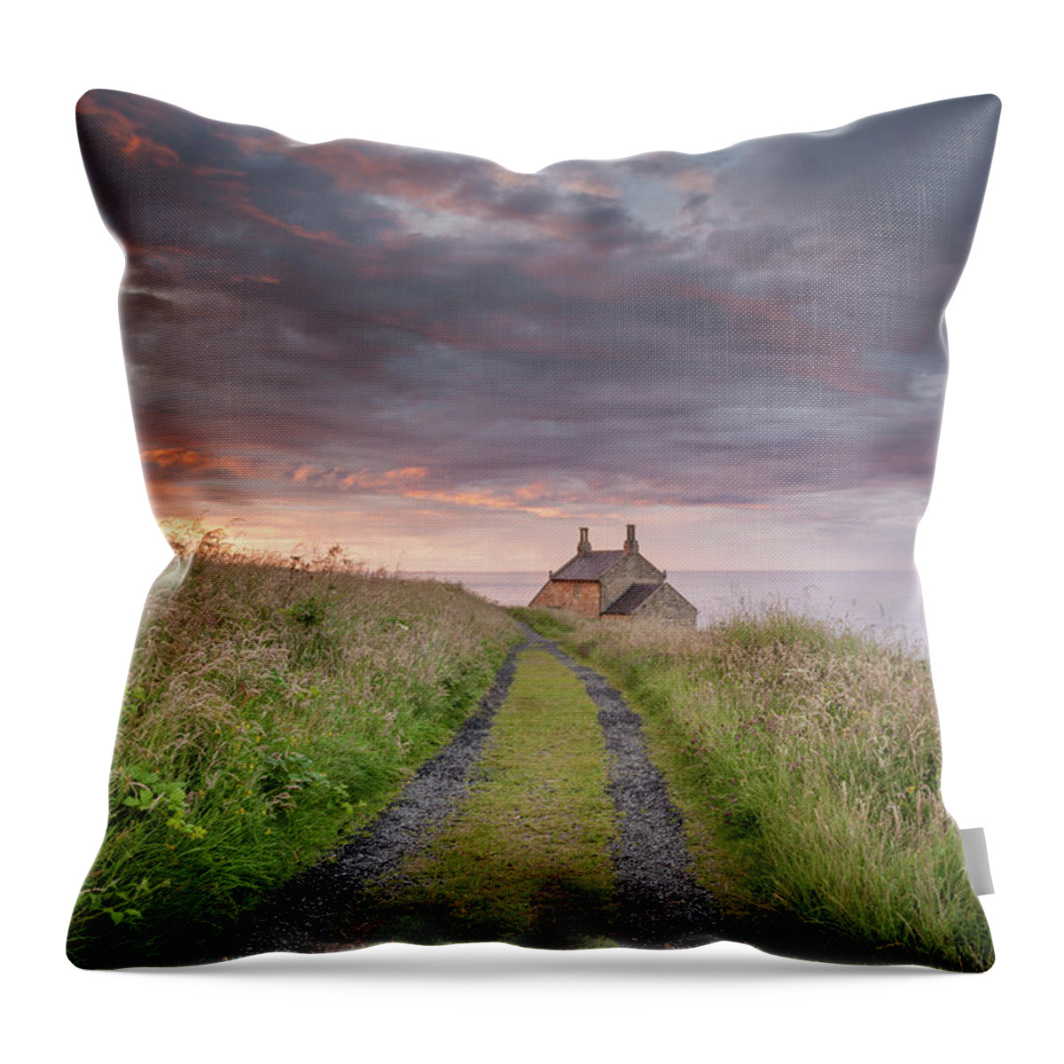 Northumberland Throw Pillow featuring the photograph A cottage by the sea by Anita Nicholson