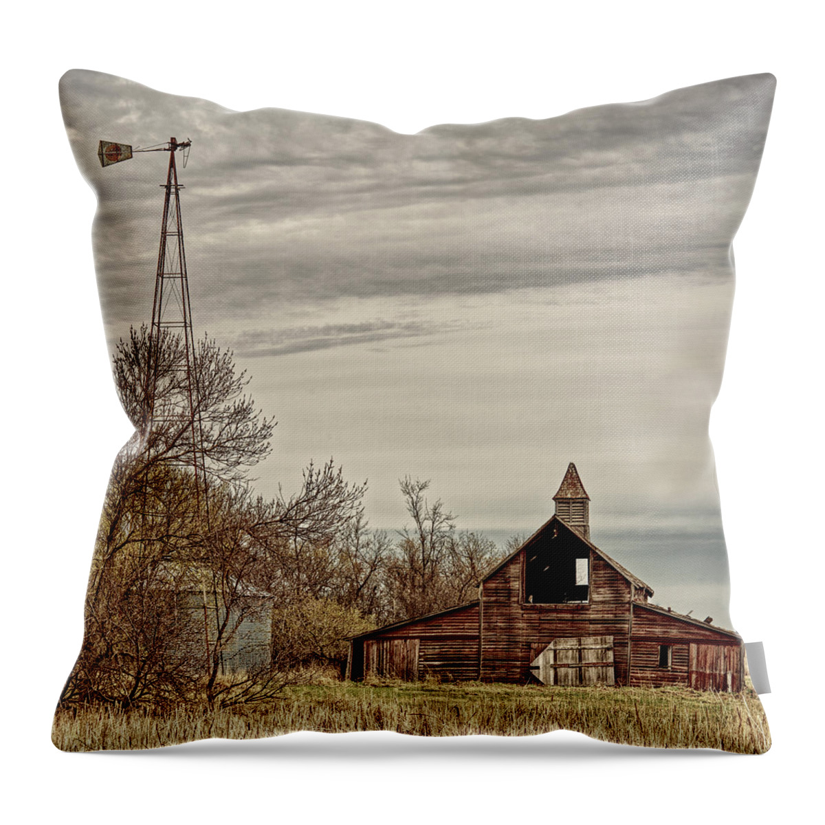Benson County Throw Pillow featuring the photograph Abandoned barn and windmill in Benson County ND homestead site by Peter Herman