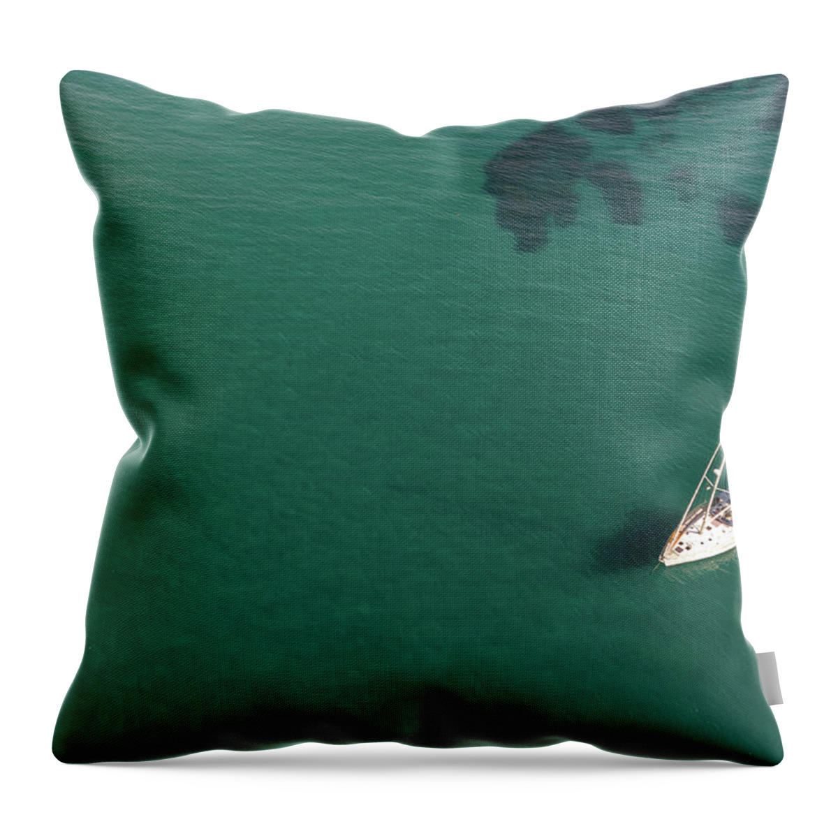 Anchored Throw Pillow featuring the photograph Aerial view of a luxury yacht anchored in the surface of the sea. Cyprus vacations by Michalakis Ppalis