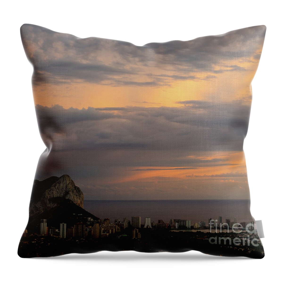 Sunset Throw Pillow featuring the photograph Clouds on the Mediterranean coast in Calpe by Adriana Mueller