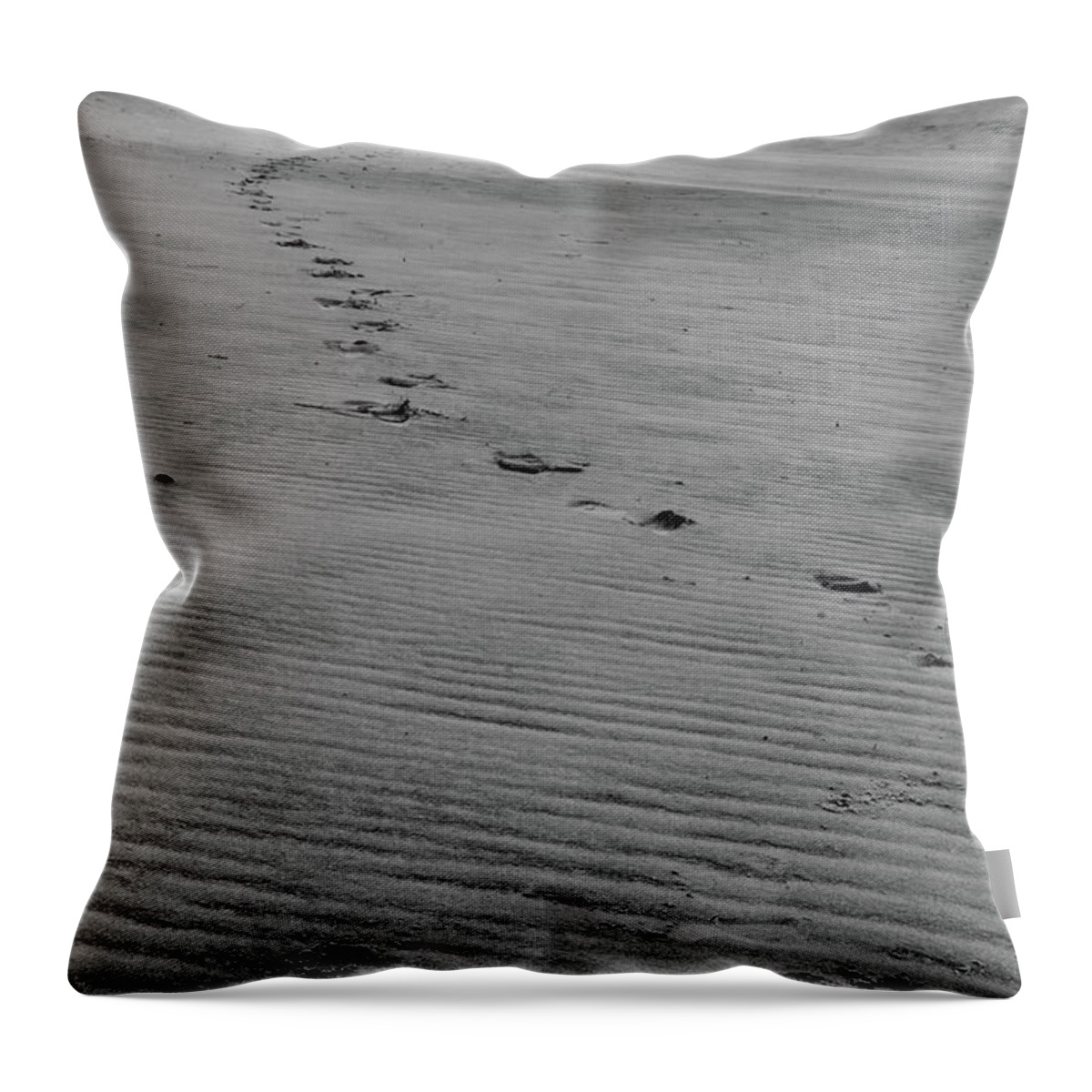 Black And White Throw Pillow featuring the photograph Footprints in the Sand by Melissa Southern