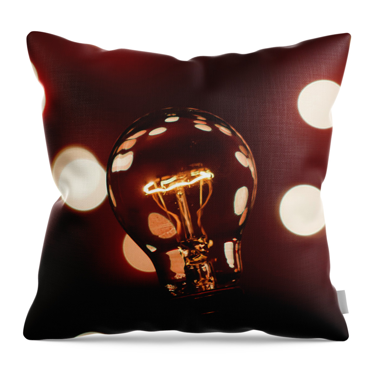 Light Bulb Throw Pillow featuring the photograph Light Bulb Bokeh by Gary Geddes