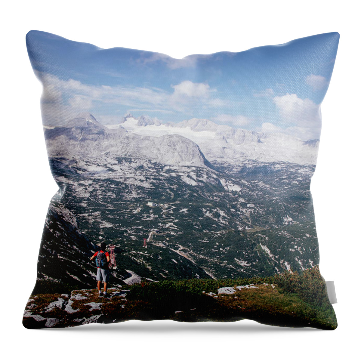 Sportive Throw Pillow featuring the photograph Man with a backpack looks at the Dachstein massif by Vaclav Sonnek