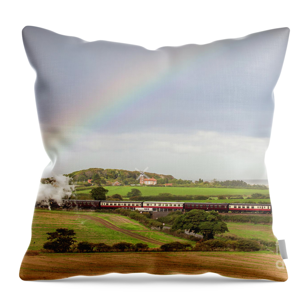 Weybourne Throw Pillow featuring the photograph Norfolk steam train with Weybourne windmill and rainbow by Simon Bratt