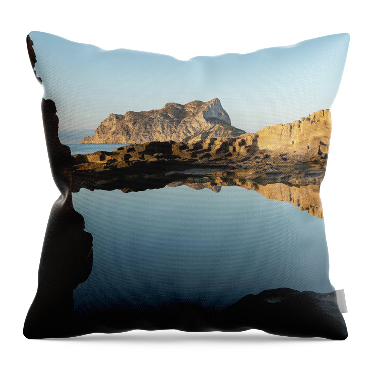 Mediterranean Throw Pillow featuring the photograph Reflection of rocks in the calm Mediterranean Sea at sunrise 3 by Adriana Mueller
