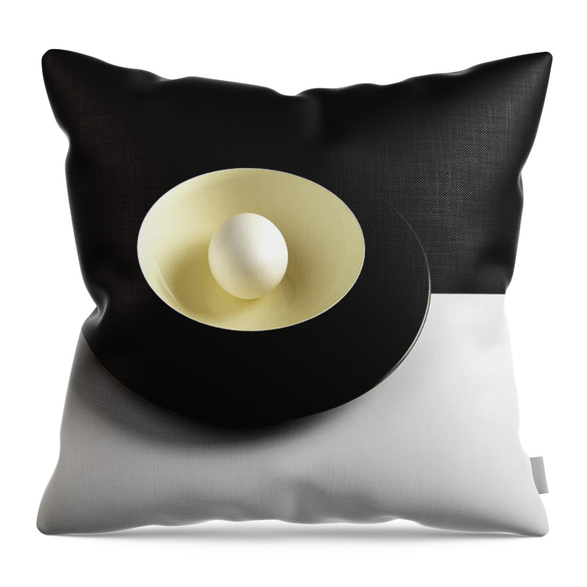 Still-life Throw Pillow featuring the photograph Single fresh white egg on a yellow bowl by Michalakis Ppalis
