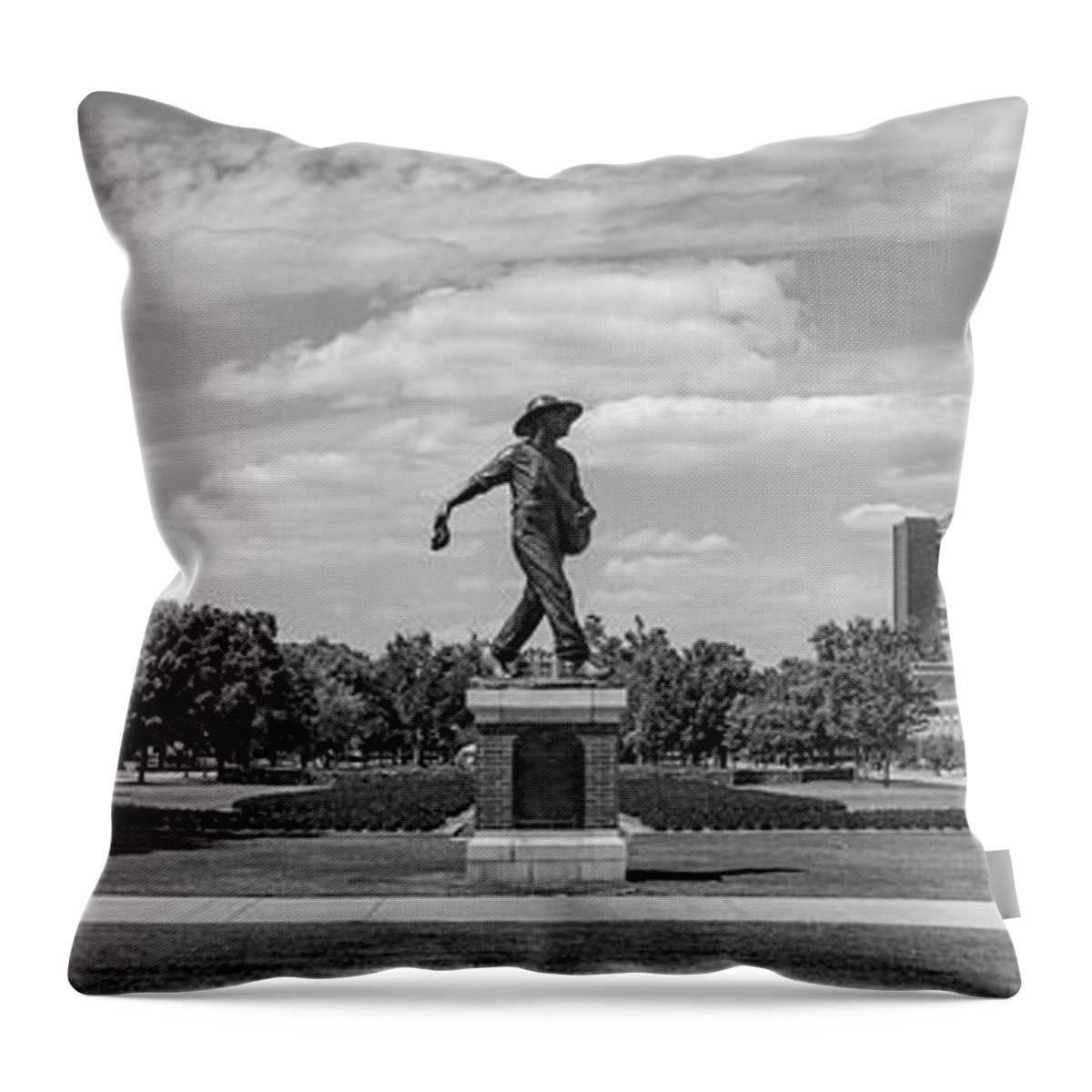 Sower Statue Throw Pillow featuring the photograph Sower Statue on the campus of the University of Oklahoma in panoramic black and white by Eldon McGraw