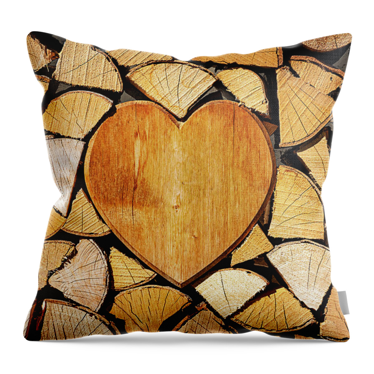 Pile Throw Pillow featuring the photograph Stack of firewood with a wooden heart by Bernhard Schaffer