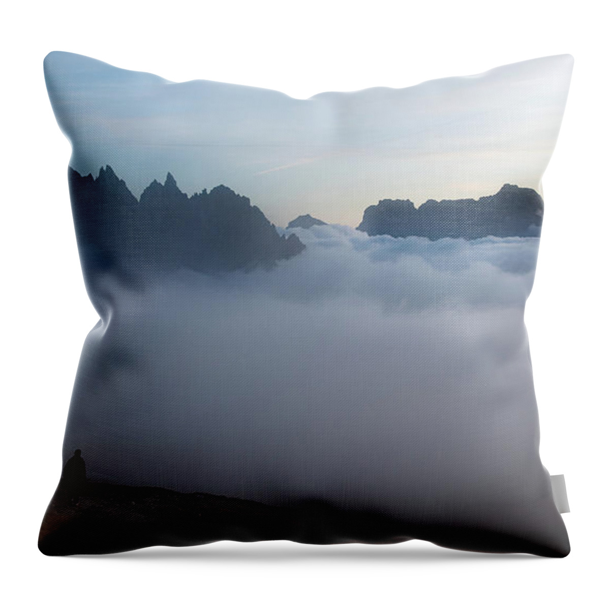 Italian Alps Throw Pillow featuring the photograph Unrecognized man trekking at the hiking path at Tre Cime in South Tyrol in Italy. by Michalakis Ppalis